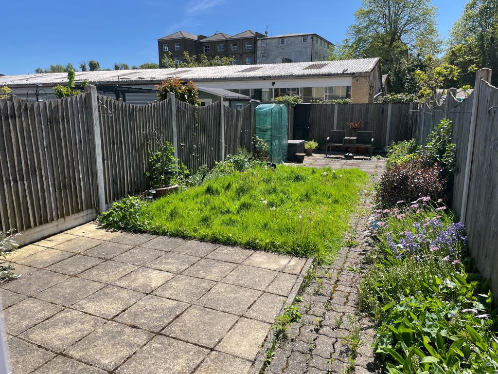 Lot: 1 - THREE-BEDROOM HOUSE FOR IMPROVEMENT - Garden with patio and lawn